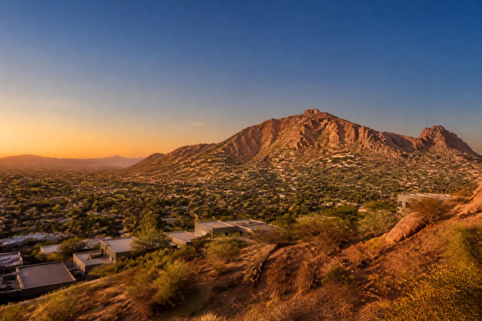 Camelback Mountain rising above Phoenix, Arizona neighborhoods at golden hour